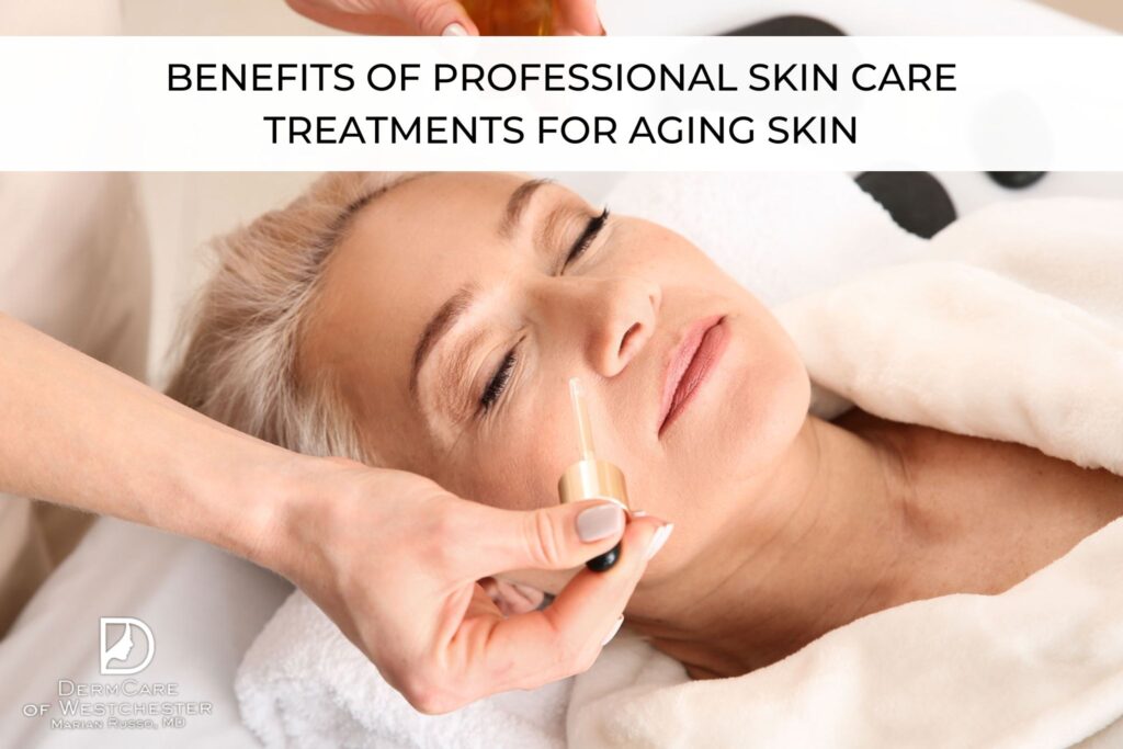 A middle-aged woman with closed eyes receiving a professional skincare treatment. A hand holds a dropper applying serum or oil to her cheek. The setting appears calm and relaxing, with the woman wrapped in a soft white robe. The image includes a text overlay at the top reading 'Benefits of Professional Skin Care Treatments for Aging Skin' and a logo for DermCare of Westchester at the bottom left corner.